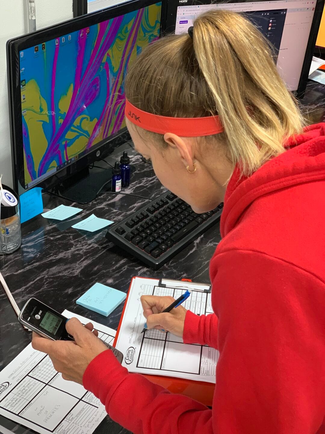 Pictured here is Clarissa, writing up a work order at Cutting Loose Graphics in Joplin MO