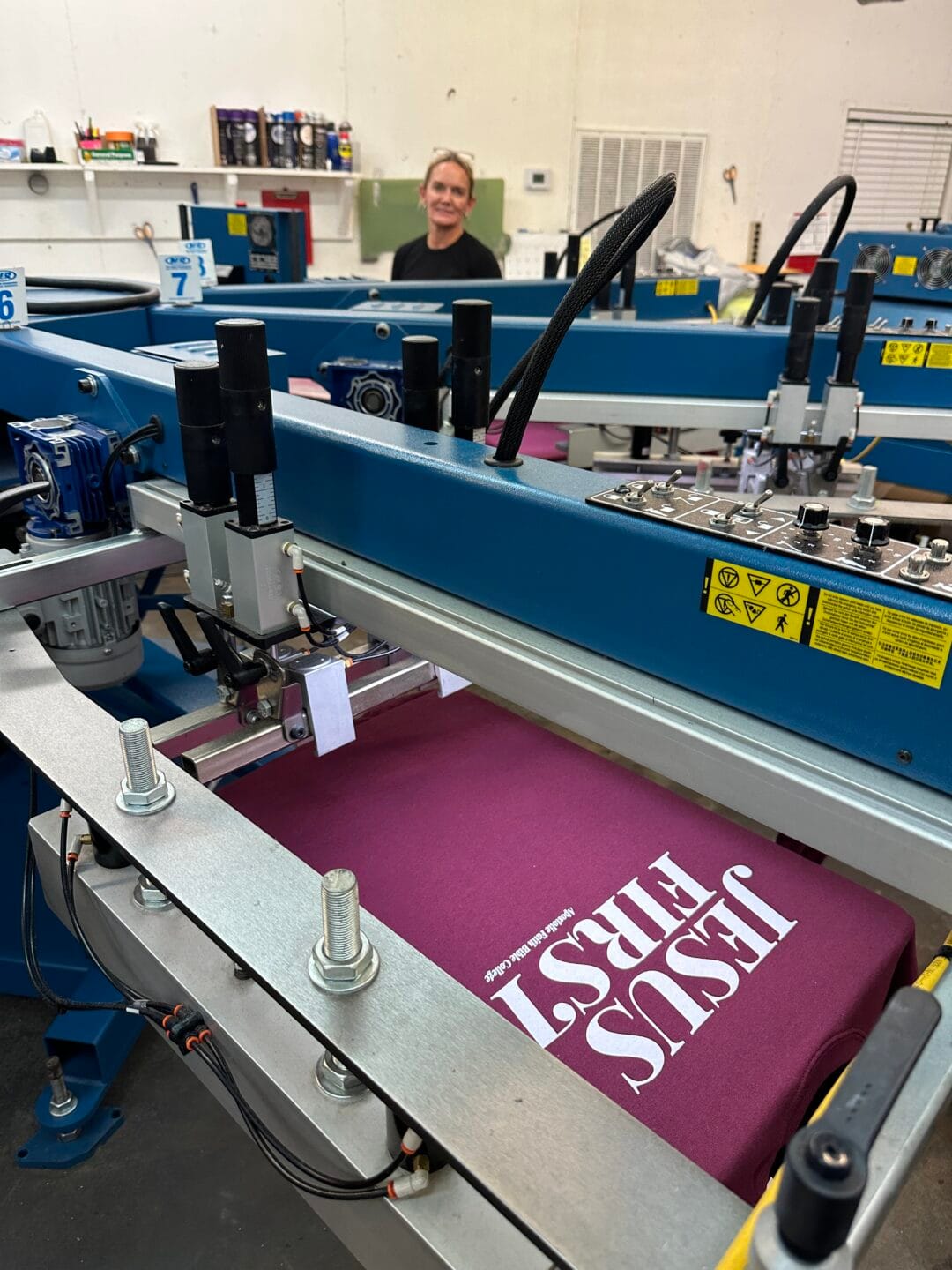 Pictured here is our M&R automatic screen printing press