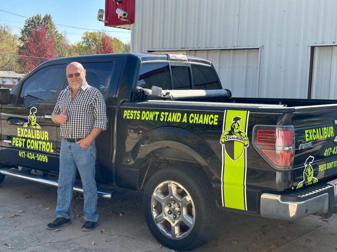 Pictured here is the Excalibur Pest Control truck, wrapped with a sporty, professional vinyl graphic design.