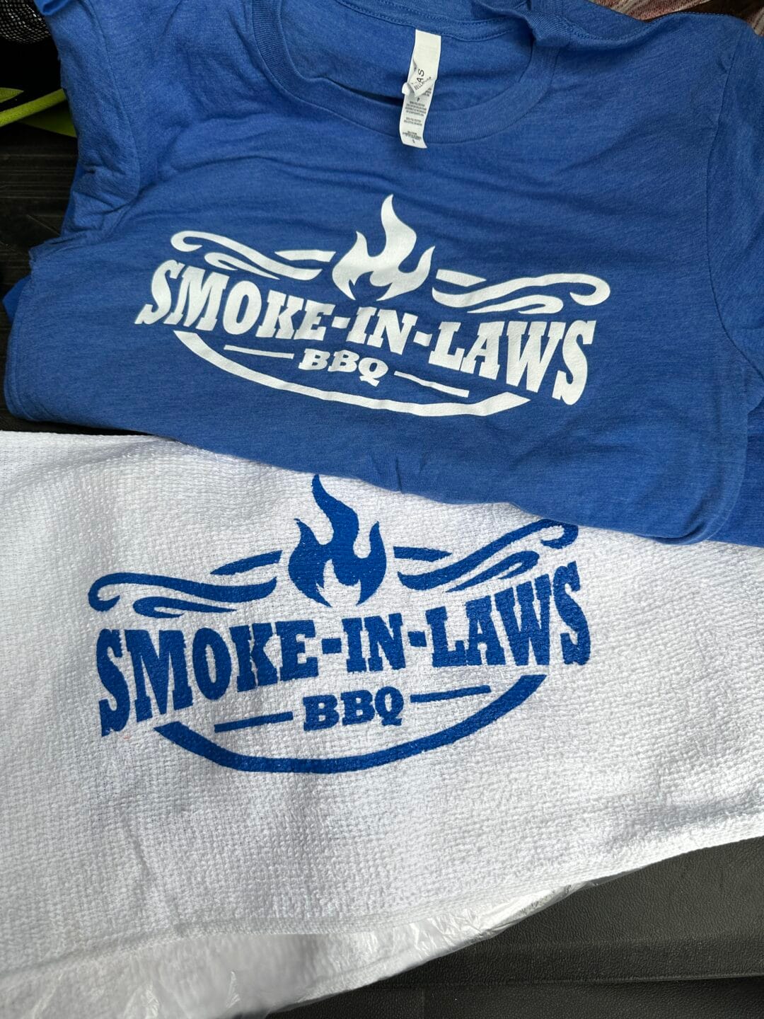 Pictured here are Custom Screen Printed Bella Canvas t-shirts and white rally towels.