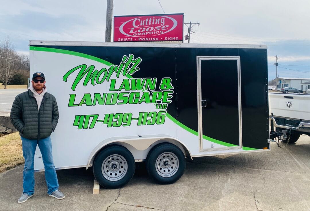 Pictured here is the freshly wrapped lawn and landscape trailer for Jake Mortz.