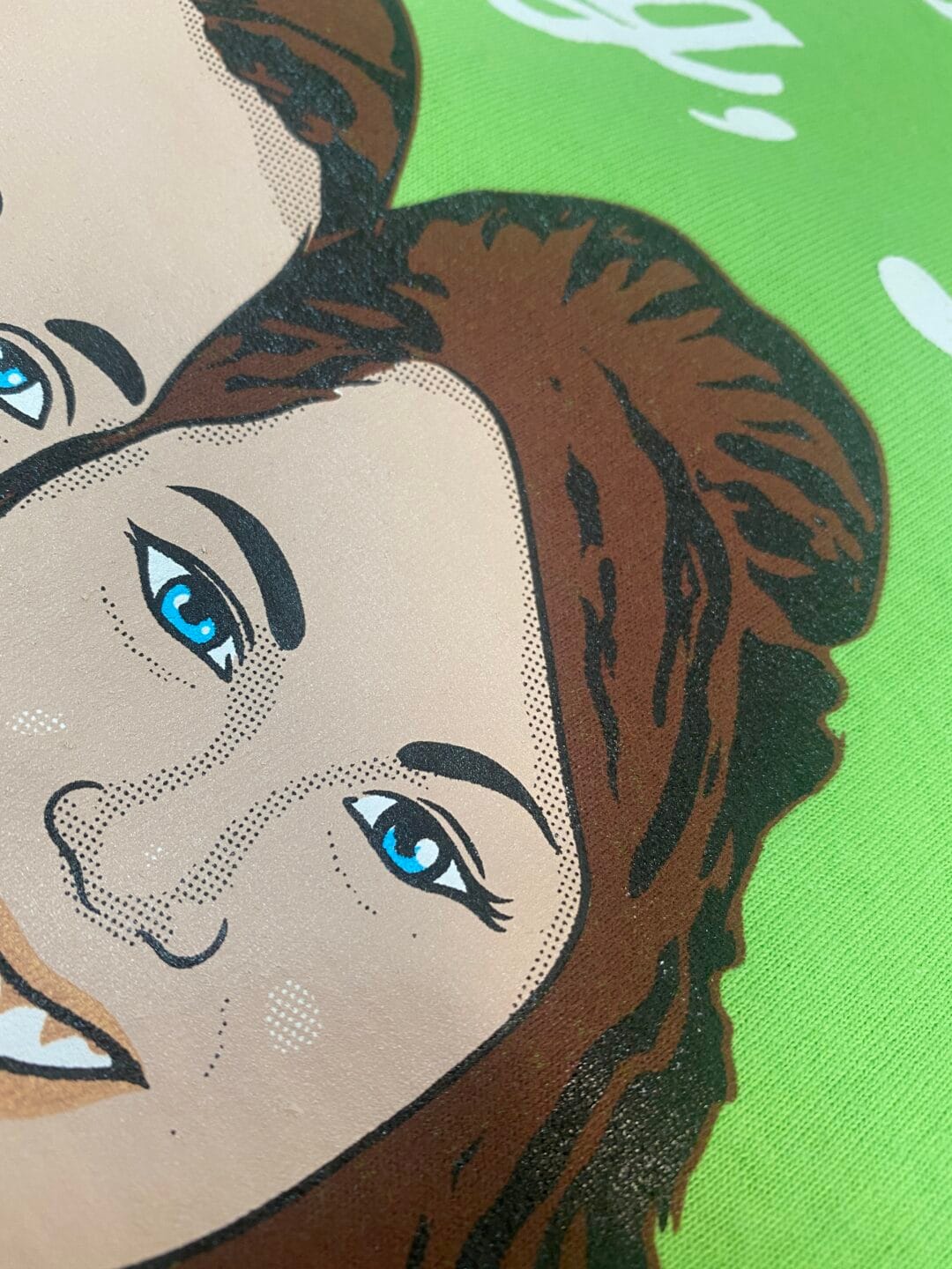 Pictured here is a close-up of a halftone gradient from one of our custom screen printed designs.