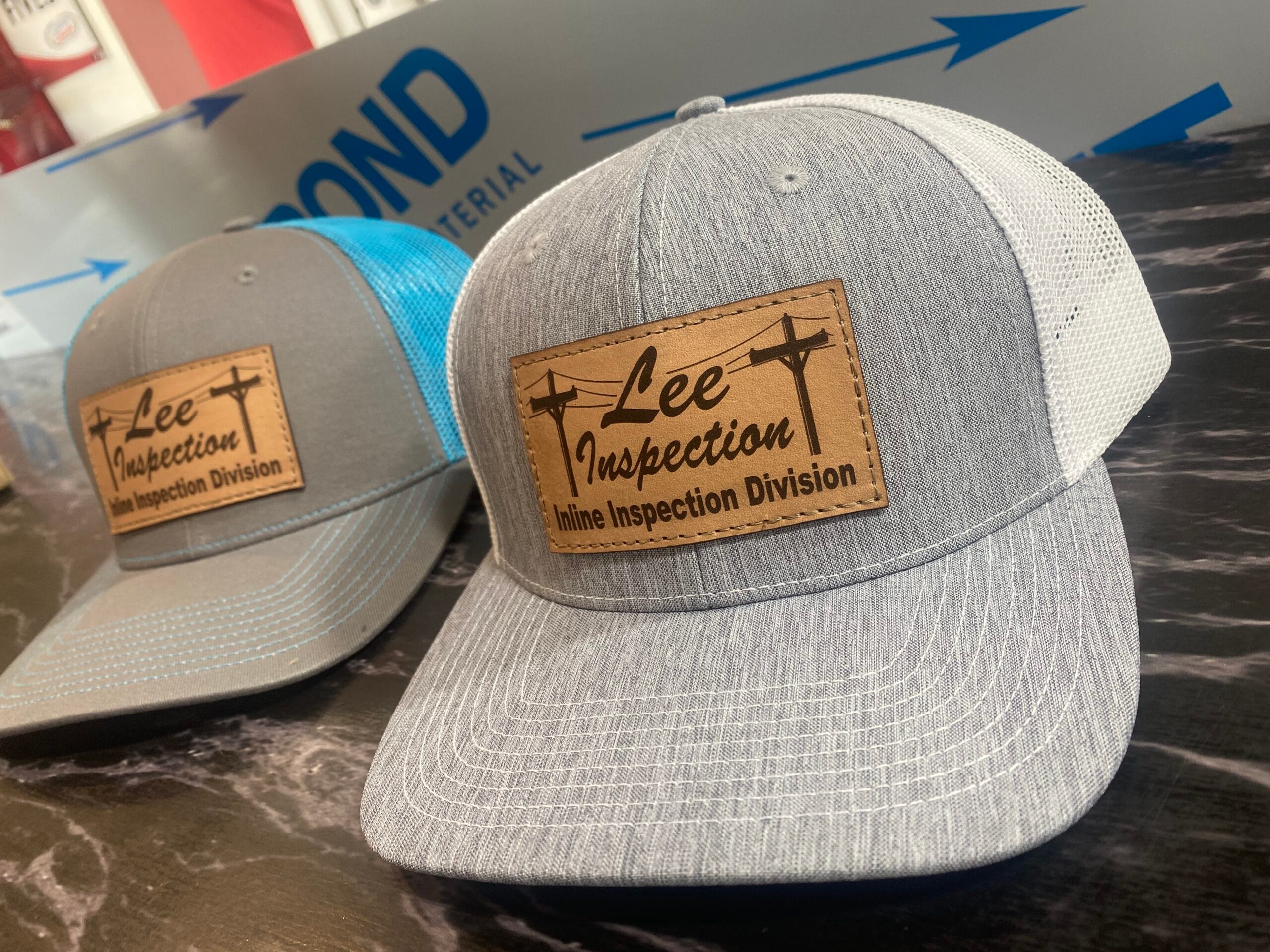 Pictured here are leather patch hats we created for Lee Inspection