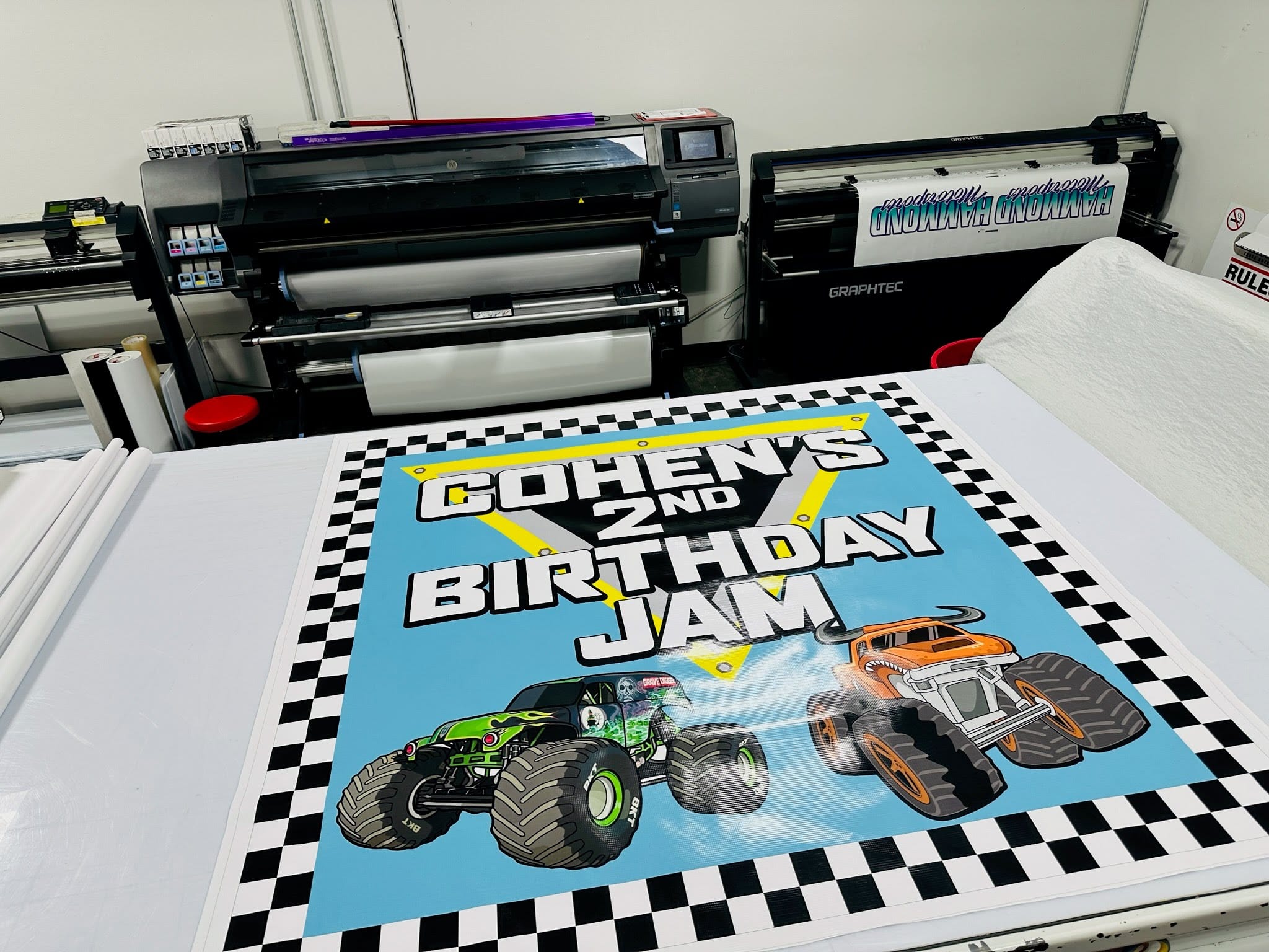 A big, bold banner that says " COHEN'S 2nd BIRTHDAY JAM"